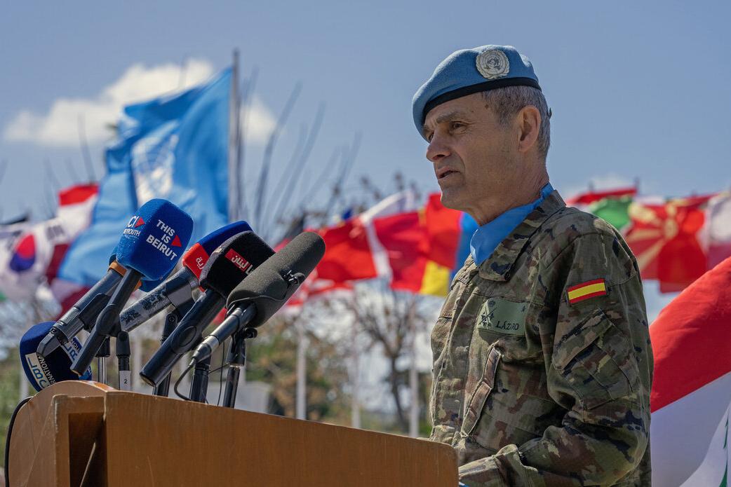 Lieutenant General Aroldo Lázaro addresses a crowd at a podium.