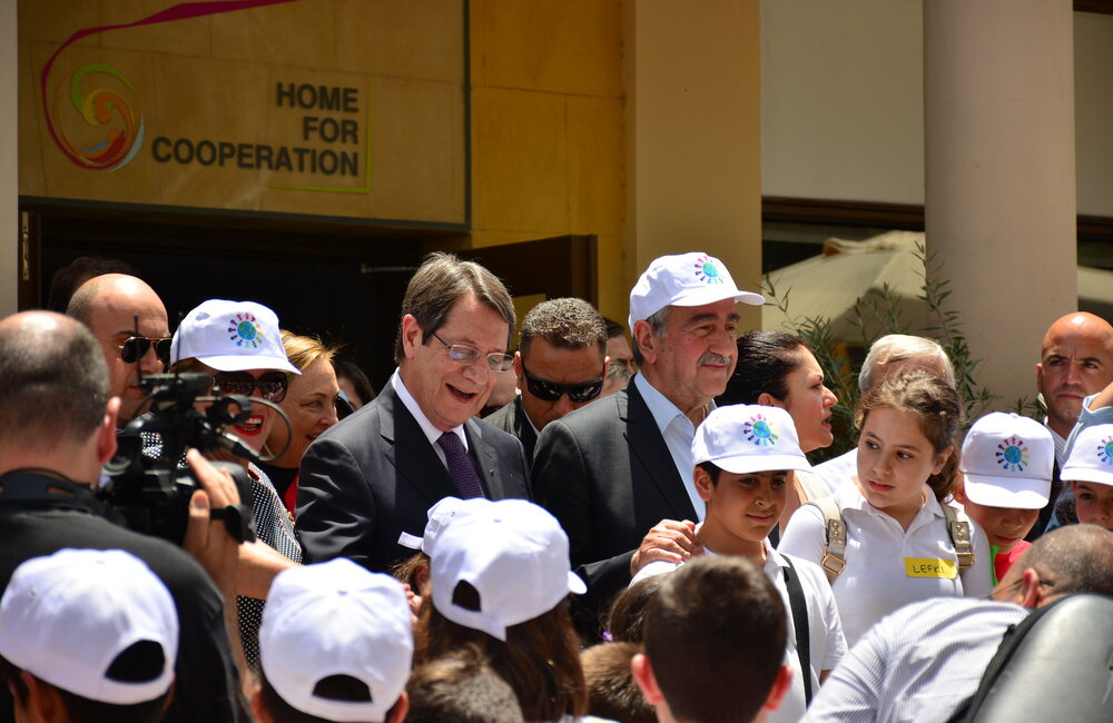 Mr. Nicos Anastasiades and Mustafa Akıncı join children at the inaugural event of the Technical Committee on Education at the Home for Cooperation in the UN buffer zone on 2 June 2016. UNFICYP/Juraj Hladky