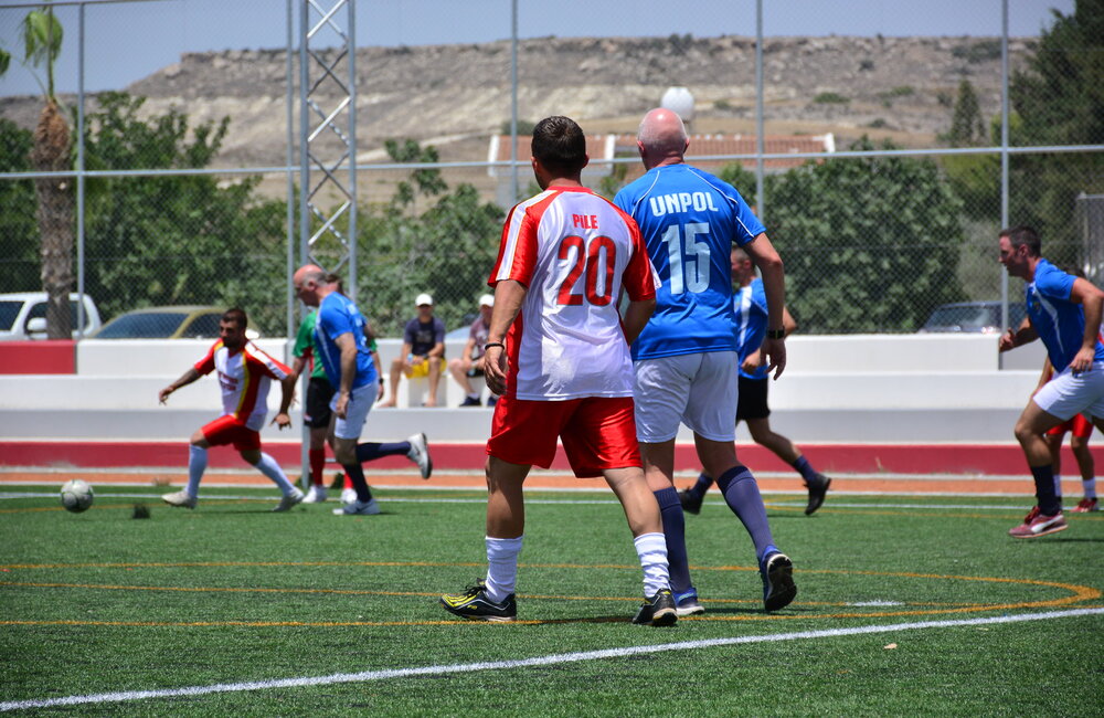 A team from the Turkish Cypriot community takes on a UN team during the 2nd bicommunal football tournament in Pyla on 19 June 2016. UNFICYP/Juraj Hladky