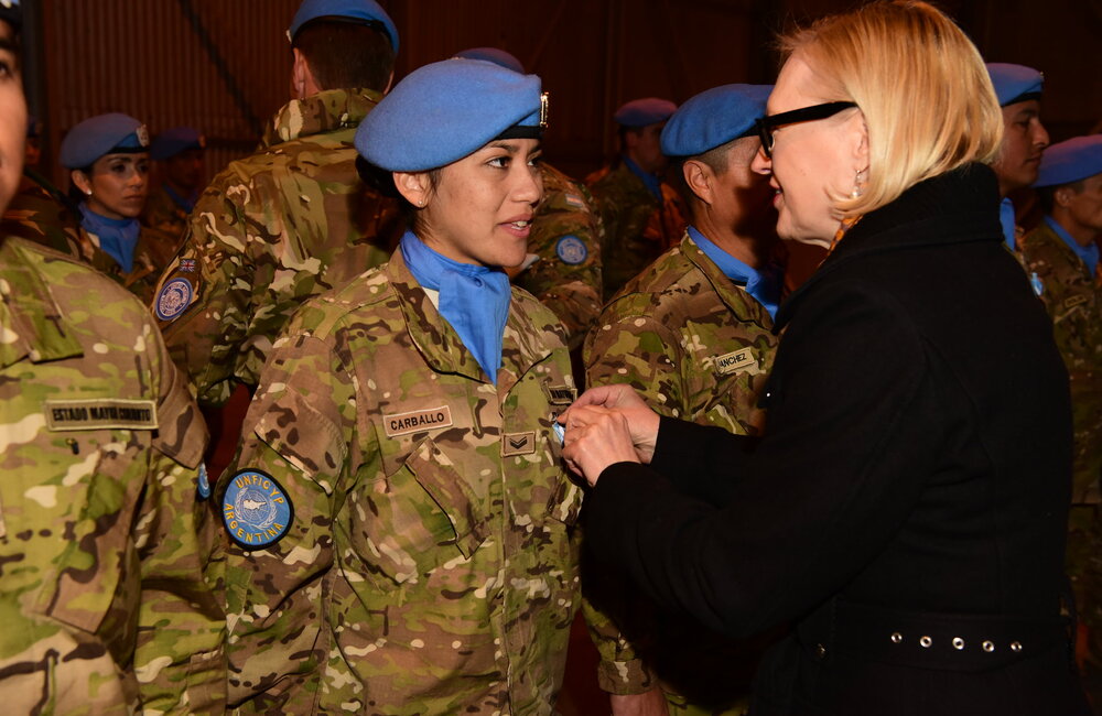 SRSG Spehar decorates one of 226 recipients of a UN medal in the service of peace during UNFICYP's annual Winter Medal Parade in the UN buffer zone, held on 2 February 2017. UNFICYP/Ludovit Veres