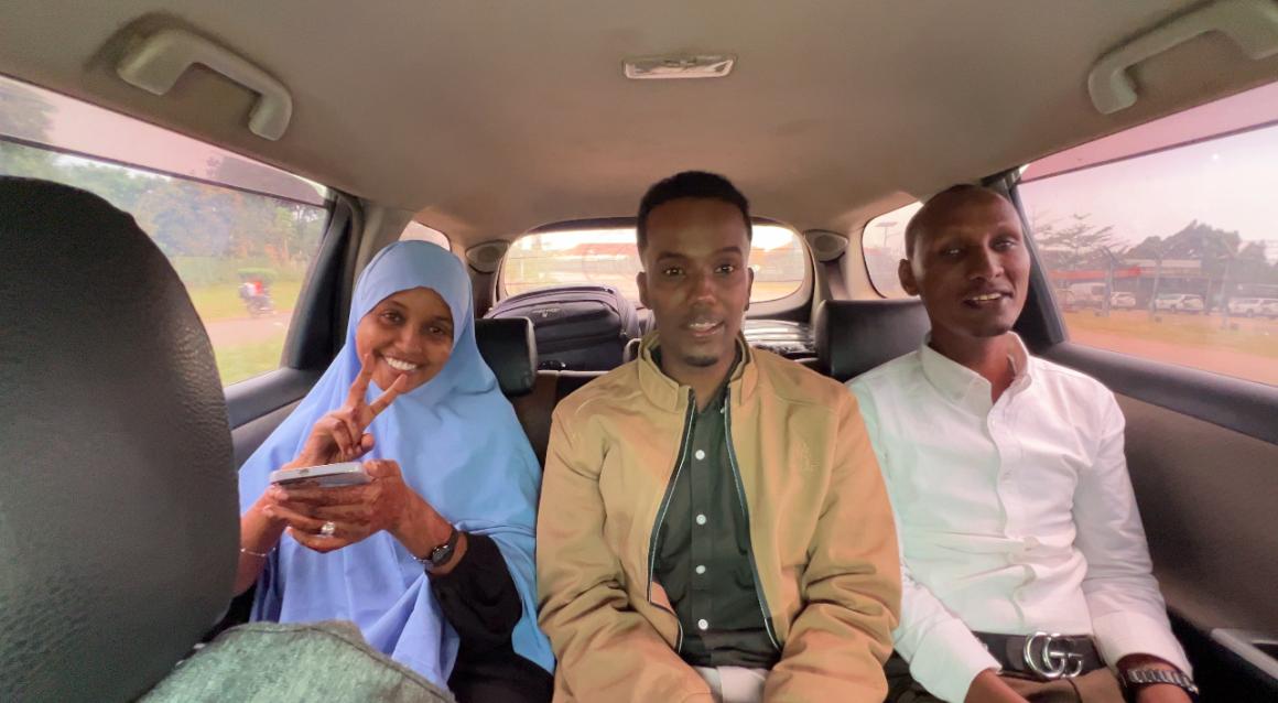 A photo of members of UDHAN team in a car arrive at Kampala to participate in a week-long training on braille production and digital inclusion.